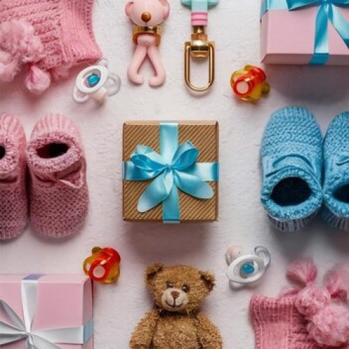 baby-accessories-concept-top-view-vertical-photo-pink-blue-knitted-booties-gift-boxes-teddy_1311477-136690 (1)